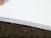 Crawl space insulation installed in California on a dirt floor