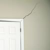 A long drywall crack beginning at the corner of a doorway in a Torrance home.