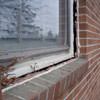 A gap in a window along the outer wall due to foundation settlement of a Huntington Beach home.