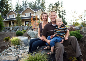 A happy family outside a home with a repaired foundation in Ontario